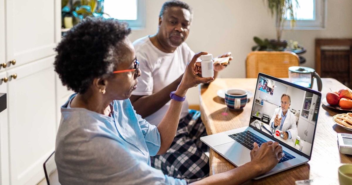 Married couple consult with their physician via telehealth
