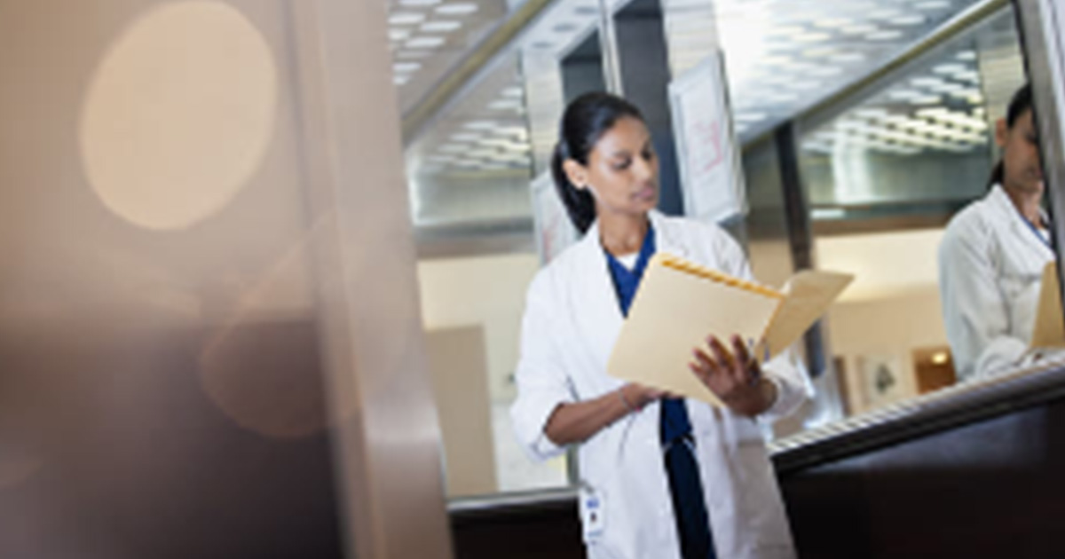 Healthcare worker looking at files