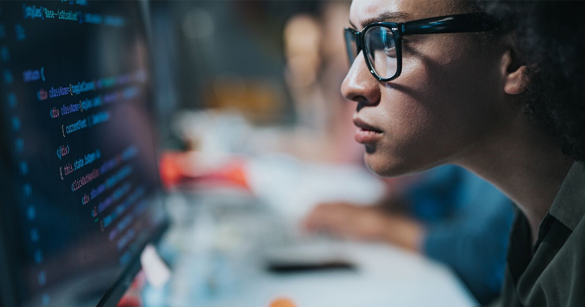 Worker looking at computer code