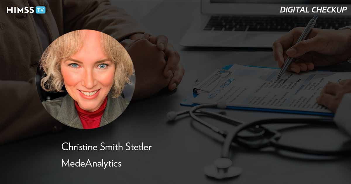 Christine Stetler at MedeAnalytics_Doctor showing medical record to patient Photo by Moment Makers Group/iStock/Getty Images Plus