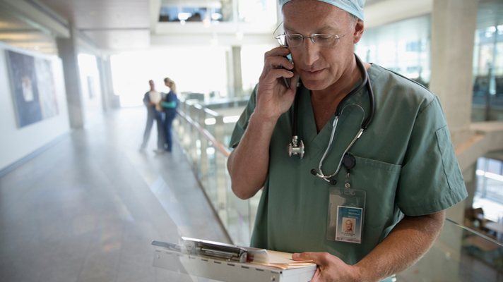 Doctor using smartphone.