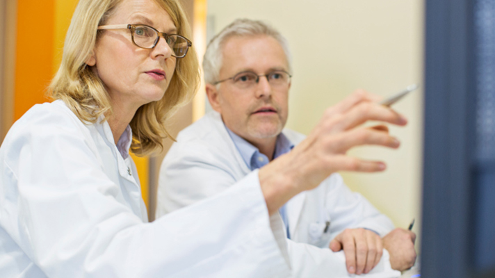 Doctors looking at a monitor