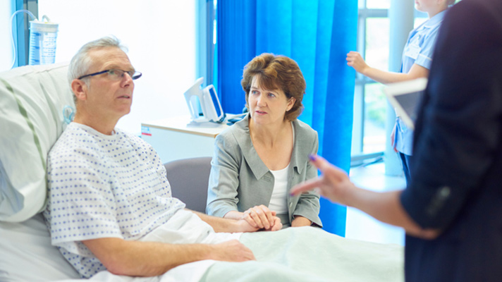 Senior patient speaking to doctor.