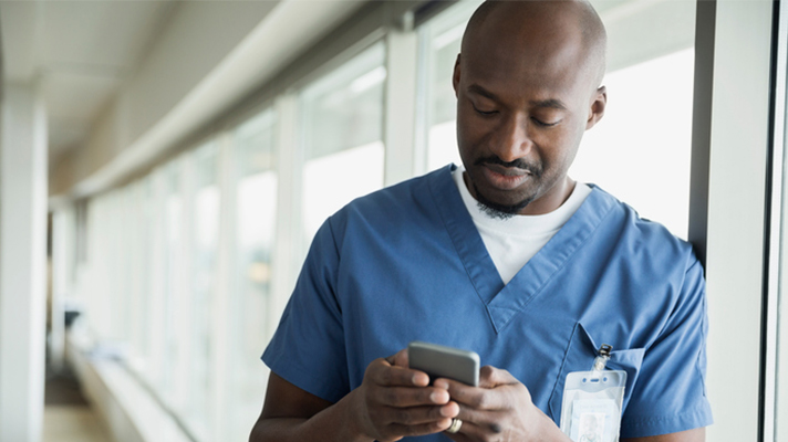 Doctor using smartphone.