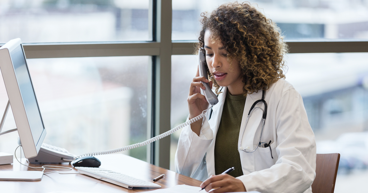 A doctor taking a phone call
