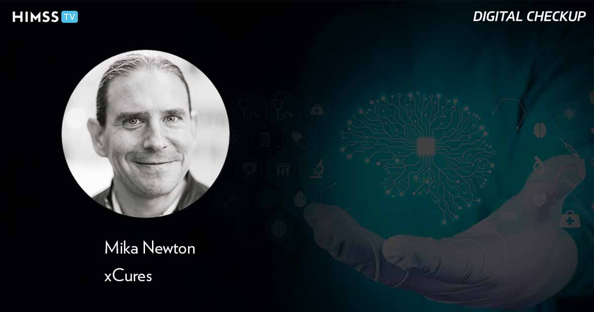 Mika Newton, xCures_Doctor's hand holding brain with AI chip Photo by Marco Marca/iStock/Getty Images Plus