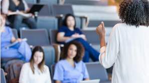 medical workers sitting in a lecture hall