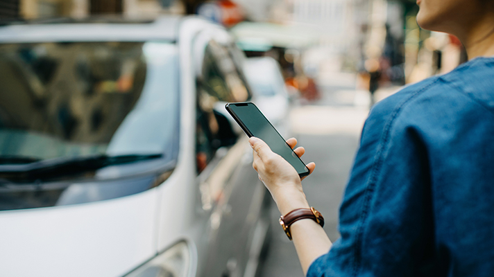 person hailing rideshare