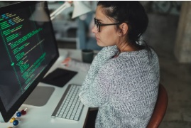 Person looking at code on a computer screen