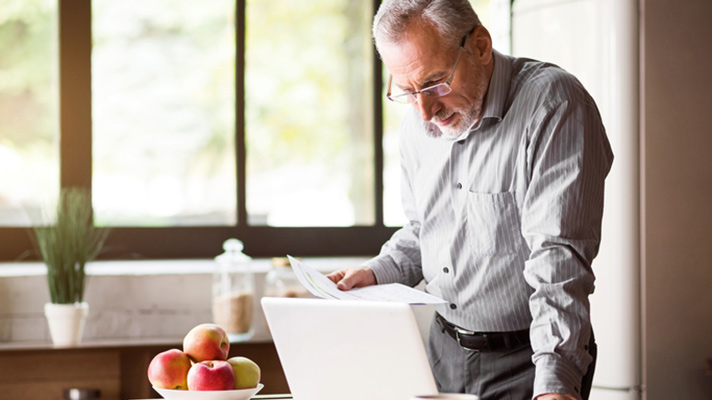 senior using laptop
