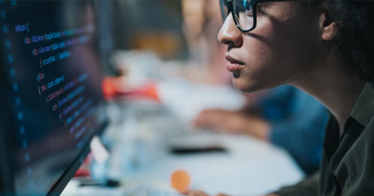 Person looking a code on a computer