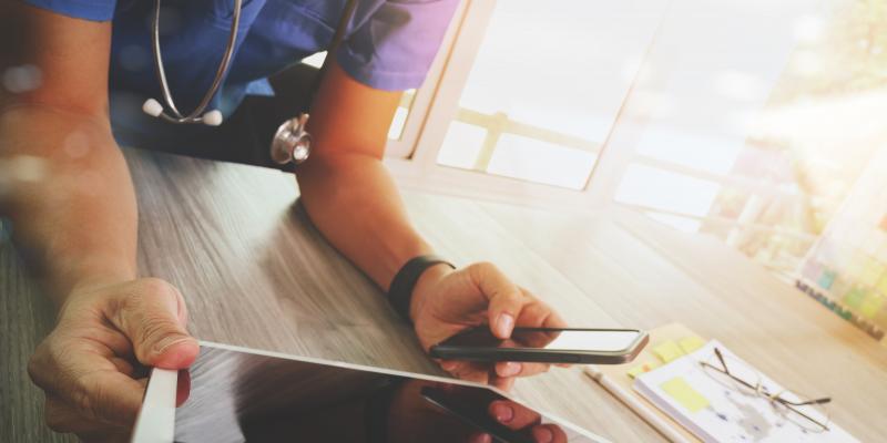 Doctor using mobile devices