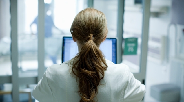 Healthcare worker looking at computer screen