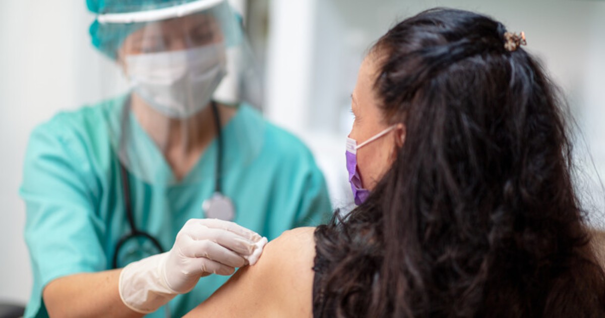 Nurse administers COVID-19 vaccine