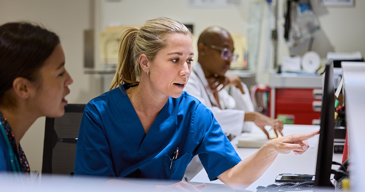 Nurses discussing new technology