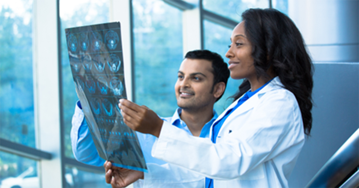 Healthcare workers looking at an X-ray