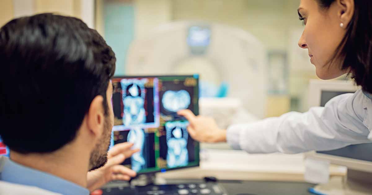 Doctors looking at X-ray on a screen