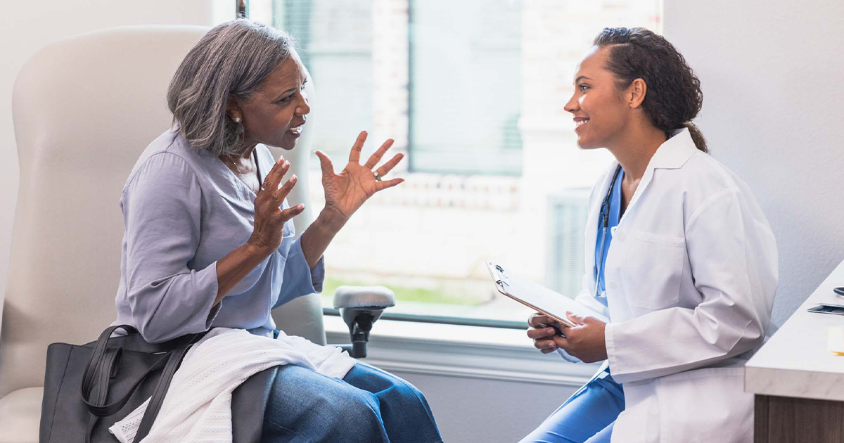 Patient talking to doctor