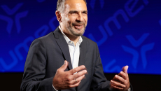 Jean-Claude Saghbini at Lumeris on stage speaking about AI