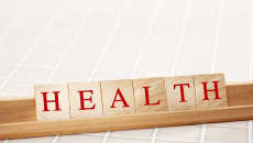 HEALTH spelled in Scrabble game tiles