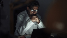 Physician working on computer