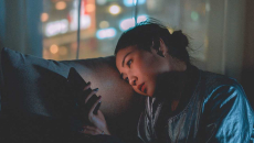 Person with a smartphone on a couch