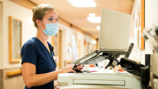 A nurse on a computer