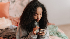 Person at home with smartphone