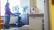 A nurse accessing records in a computer