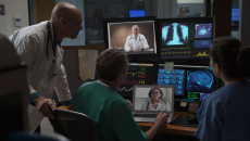 Doctors in a mixed virtual and in-person case conference