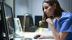 Health professional at computer screen