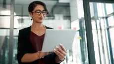 mental health provider looks at her business information on a tablet