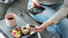 Mid adult diabetic woman having breakfast at home 