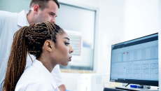 Scientists working at computer_Sponsored_Getty-Nitat Termmee