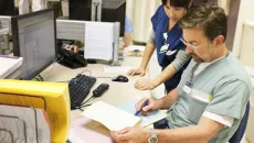 Healthcare workers working at desk