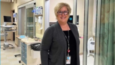 Worker standing in a hospital room