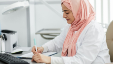 A doctor writing a prescription