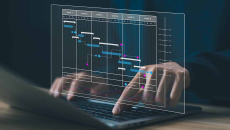 Data table display projected over hands on laptop keyboard