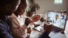Person and child attending telehealth appointment