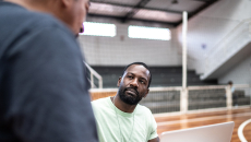 Community worker talks with patient