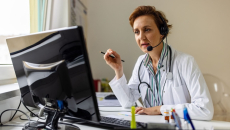 A doctor wearing a headset in a virtual consultation