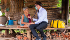 A rural doctor checking up on a patient 