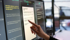 Person touching AI chatbot promot on computer module