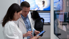 Healthcare workers looking at tablet