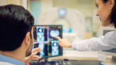 Doctors looking at X-ray on a screen