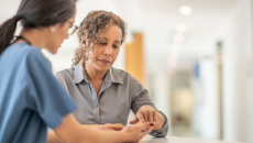 A n in-person health visit with a smartphone