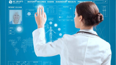 Doctor working on a transparent monitor