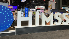 HIMSS Global Health Conference and Exhibition sign and floor exhibits