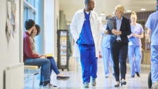 Medical staff walking down hospital hallway
