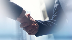 Handshake by people in suits